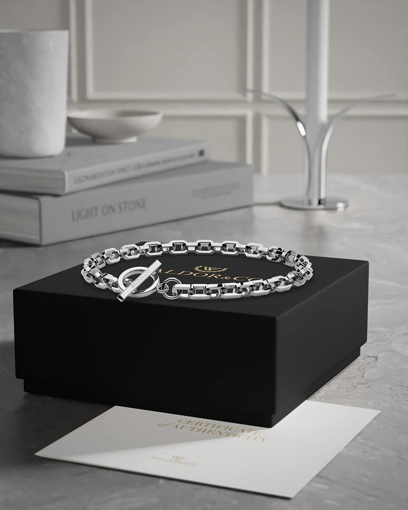 A polished stainless steel chain in silver from WALDOR & CO. The model is Demure Chain Polished.