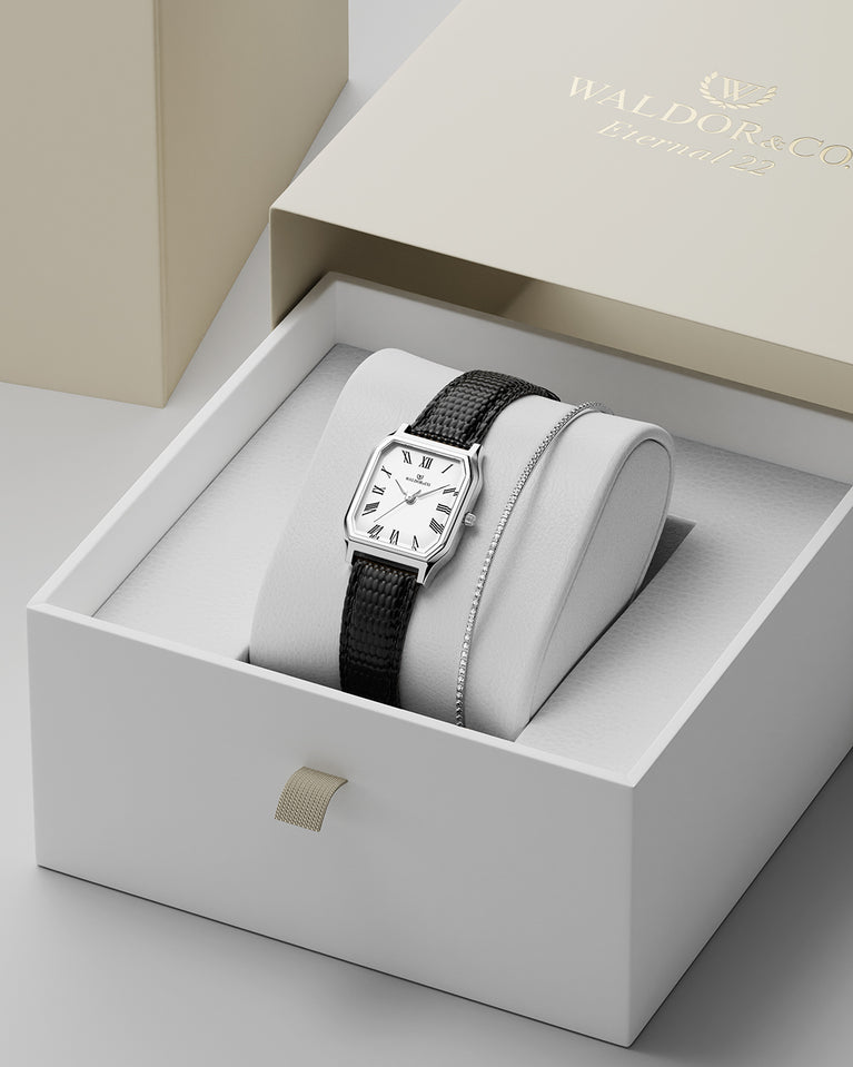 A square womens watch in Rhodium-plated 316L stainless steel from Waldor & Co. with white Diamond Cut Sapphire Crystal glass dial. Strap in black Genuine leather. Seiko movement. The model is Eternal 22 Varenna.
