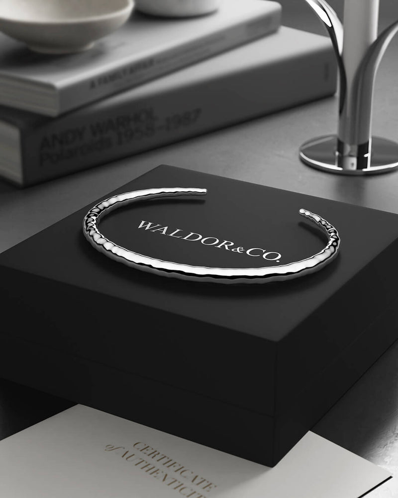 A Round Bangle in 925 Sterling Silver from Waldor & Co. The model is Opal Bangle Sterling SilverA Round Bangle in 925 Sterling Silver from Waldor & Co. The model is Opal Bangle Sterling Silver
